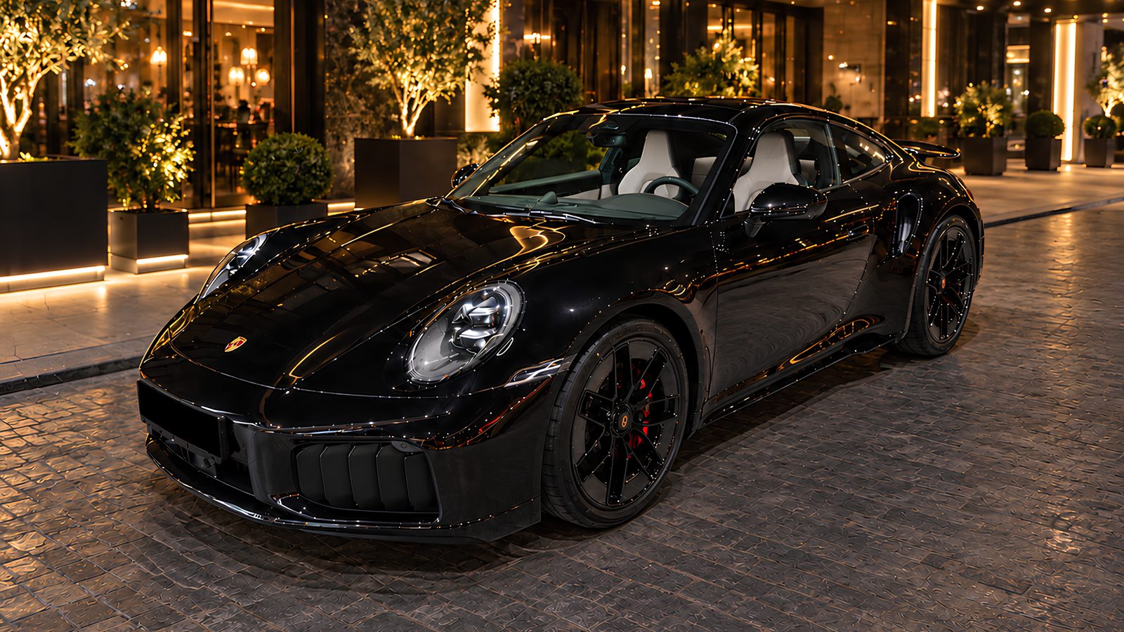 Porsche 911 Turbo S T-Hybrid 2026 noire — EVO LUXURY Fleet, réservée